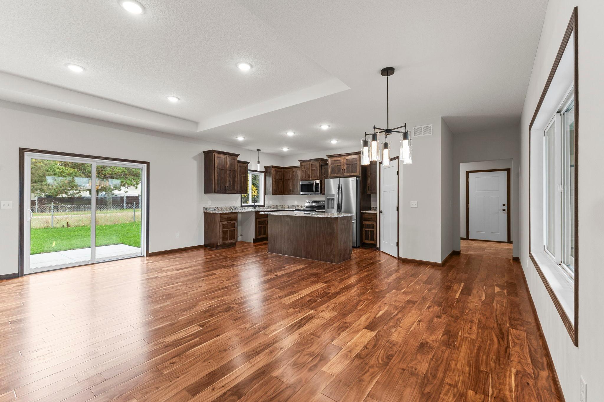 Beautiful Acacia hardwood flooring throughout the living area