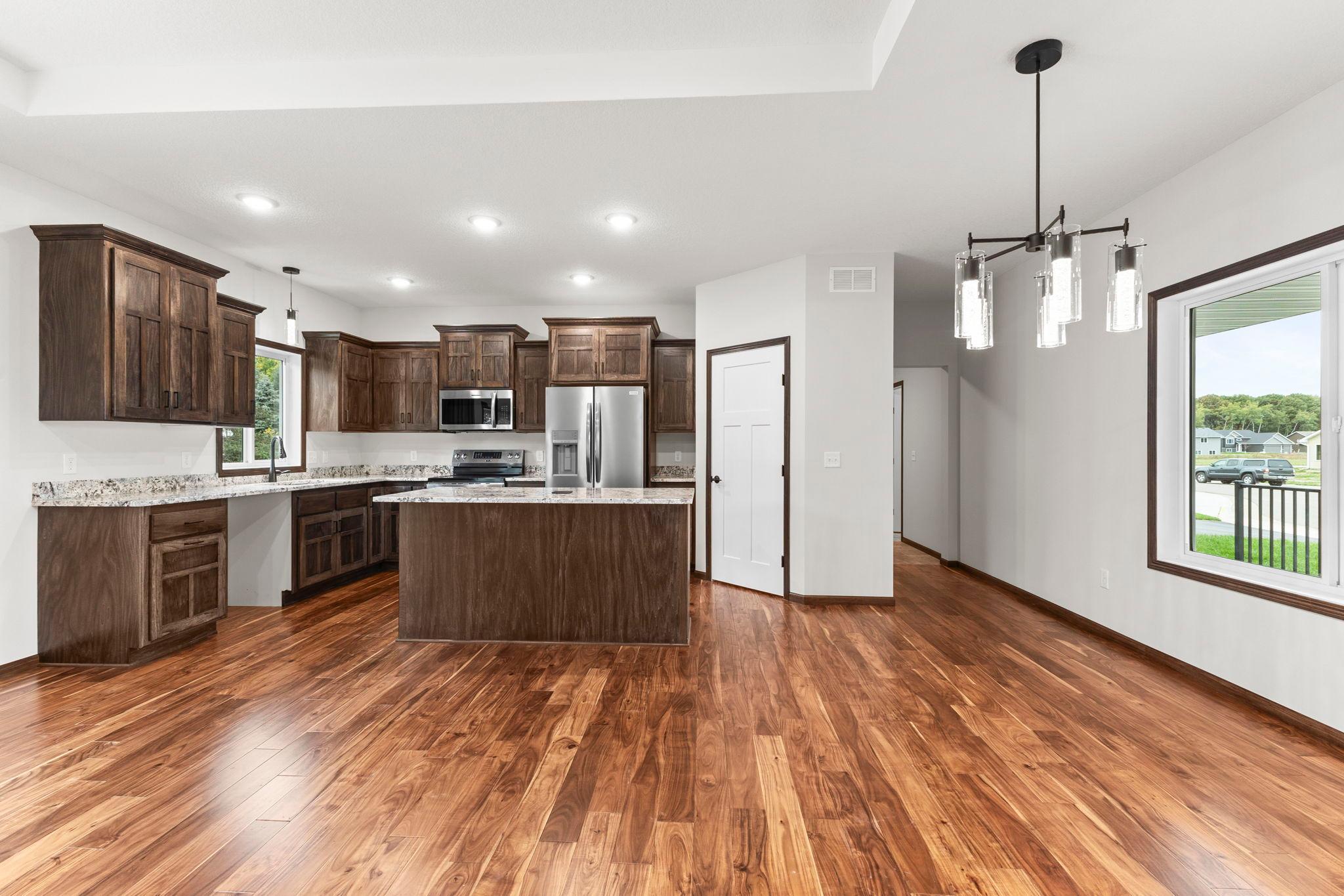 Spacious kitchen with custom cabinets and granite countertops
