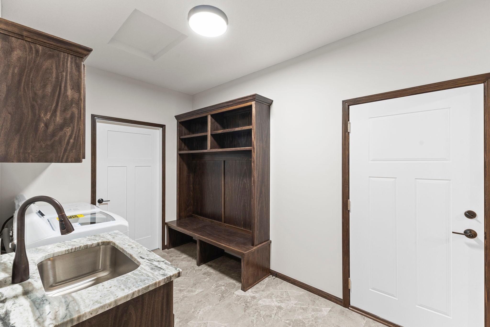 Well placed laundry/mudroom with built-in storage