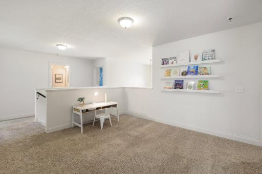 Versatile Upper-Level Loft: Situated right at the top of the stairs, this open flex space is ideal for a home office, study nook, play area, or cozy reading corner.
