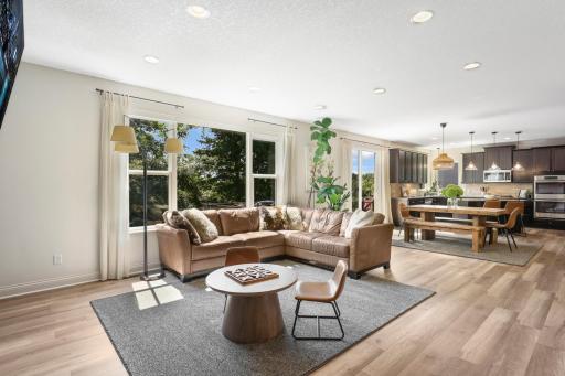 Experience effortless daily living in this expansive main level, where the sun-drenched living room connects directly to the dining area and chef’s kitchen. Large windows and a glass sliding door fill the entire space with natural light