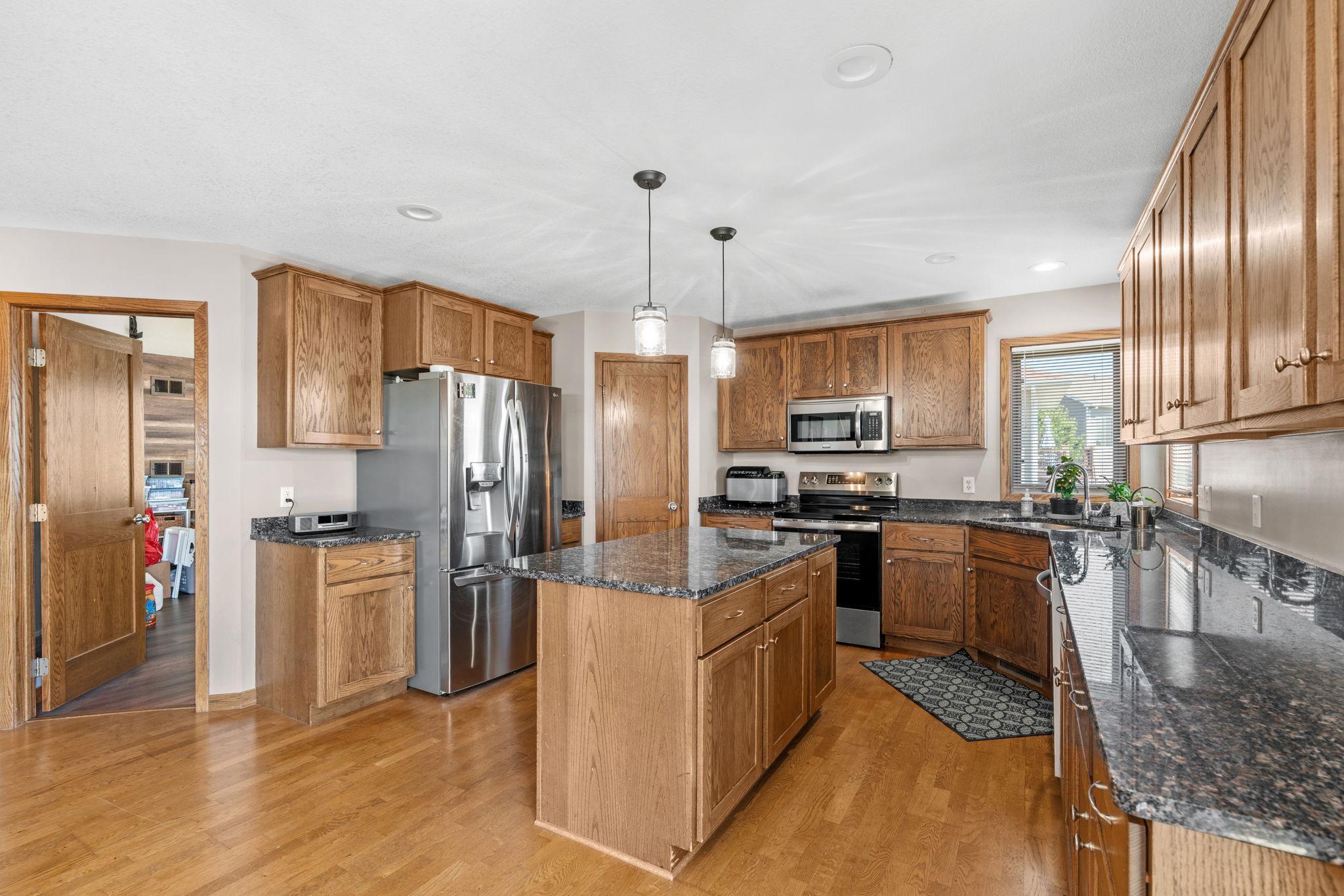 Large Kitchen with breakfast bar island and pantry closet