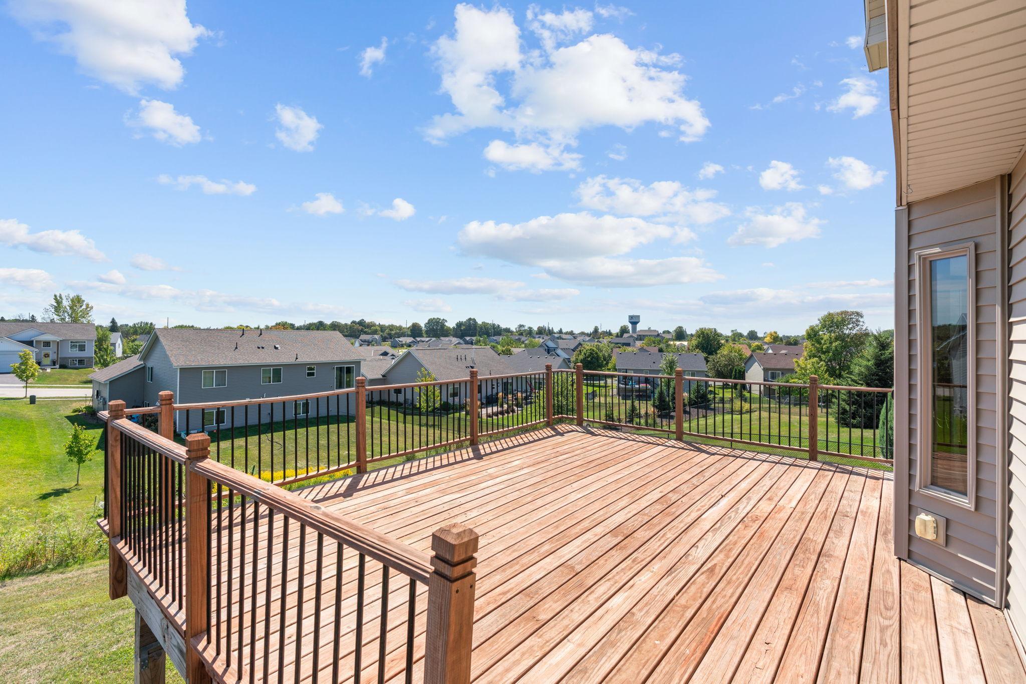 Large Deck off the main level with stairs down to the backyard