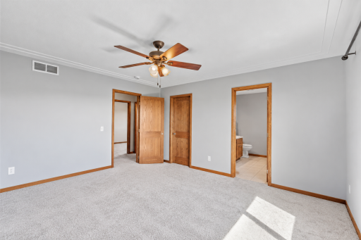 Spacious primary bedroom with private access to the full en-suite bath
