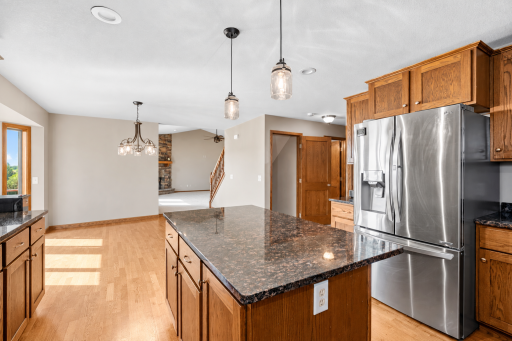 Large center island provides generous prep space in this open and functional kitchen