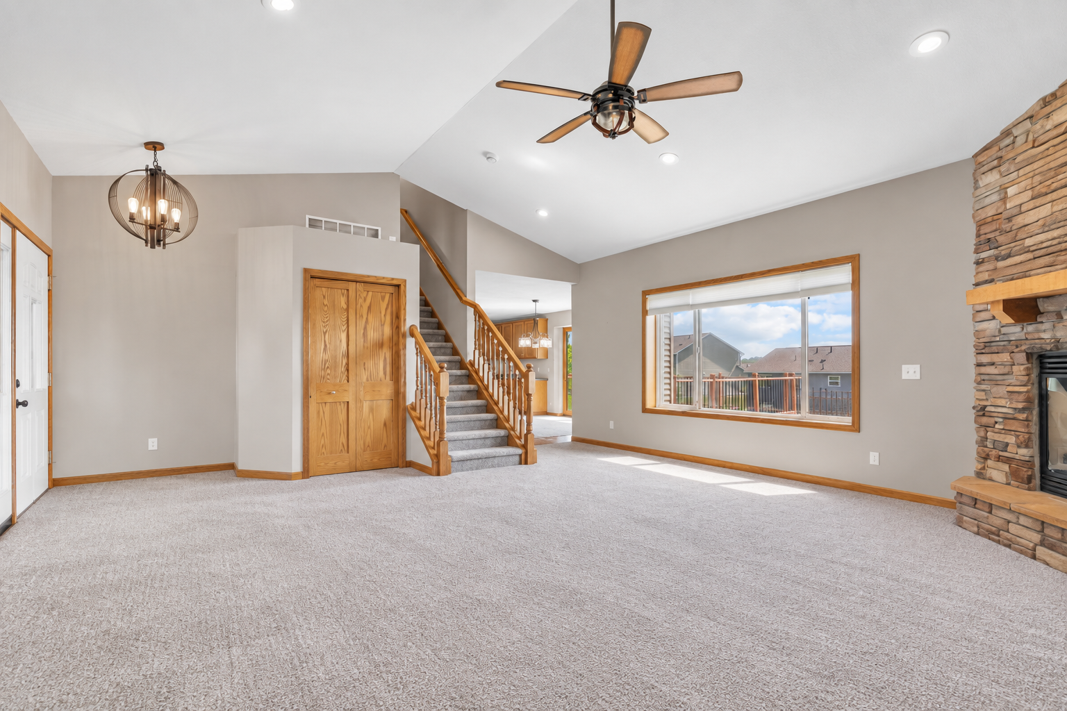 Spacious great room with vaulted ceilings, stone fireplace and plenty of room to gather and entertain.