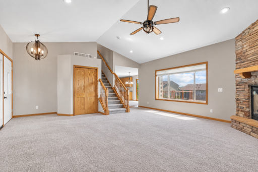 Spacious great room with vaulted ceilings, stone fireplace and plenty of room to gather and entertain.