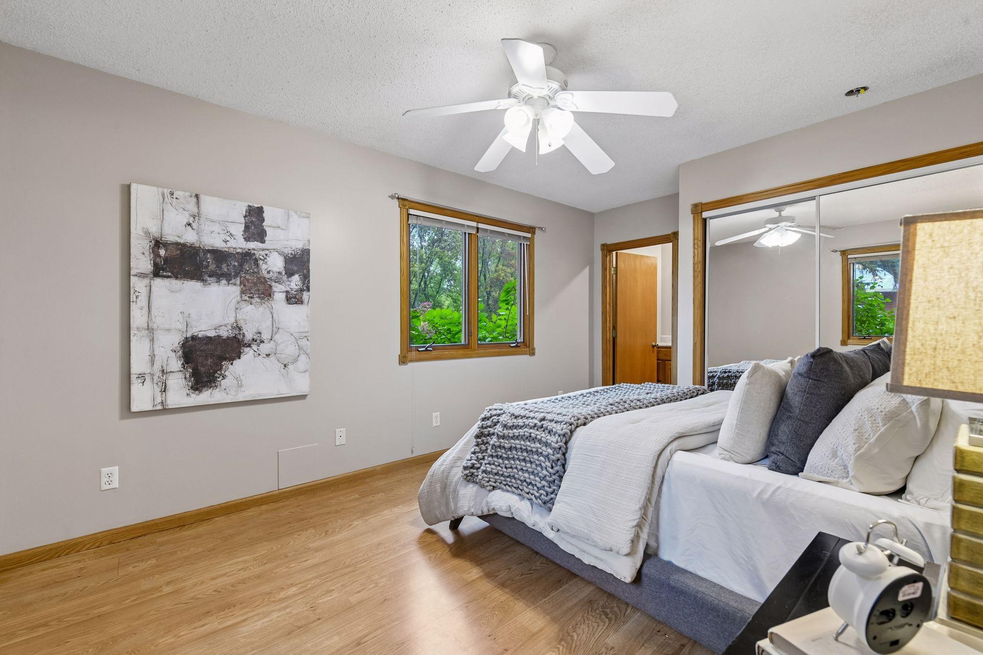 Tucked away on the main level is the primary bedroom.