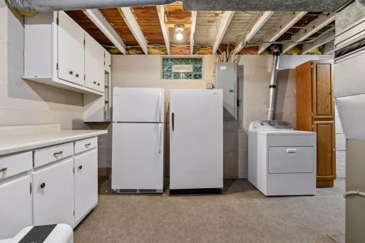 The lower level offers cabinetry to help keep you organized.
