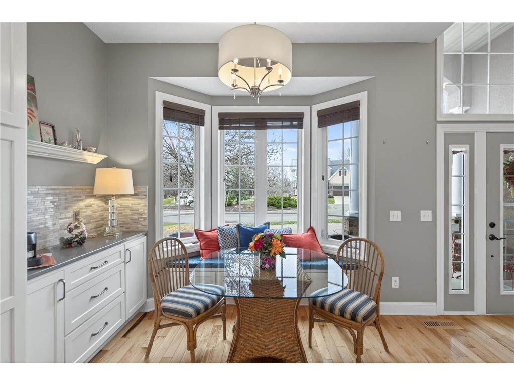 Dining area, bay window with custom bench seat located by the coffee bar