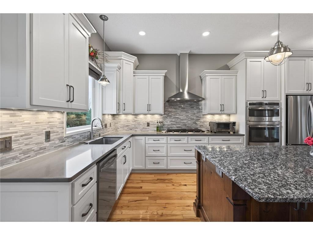 Featuring custom cabinets, silestone, under cabinet lighting