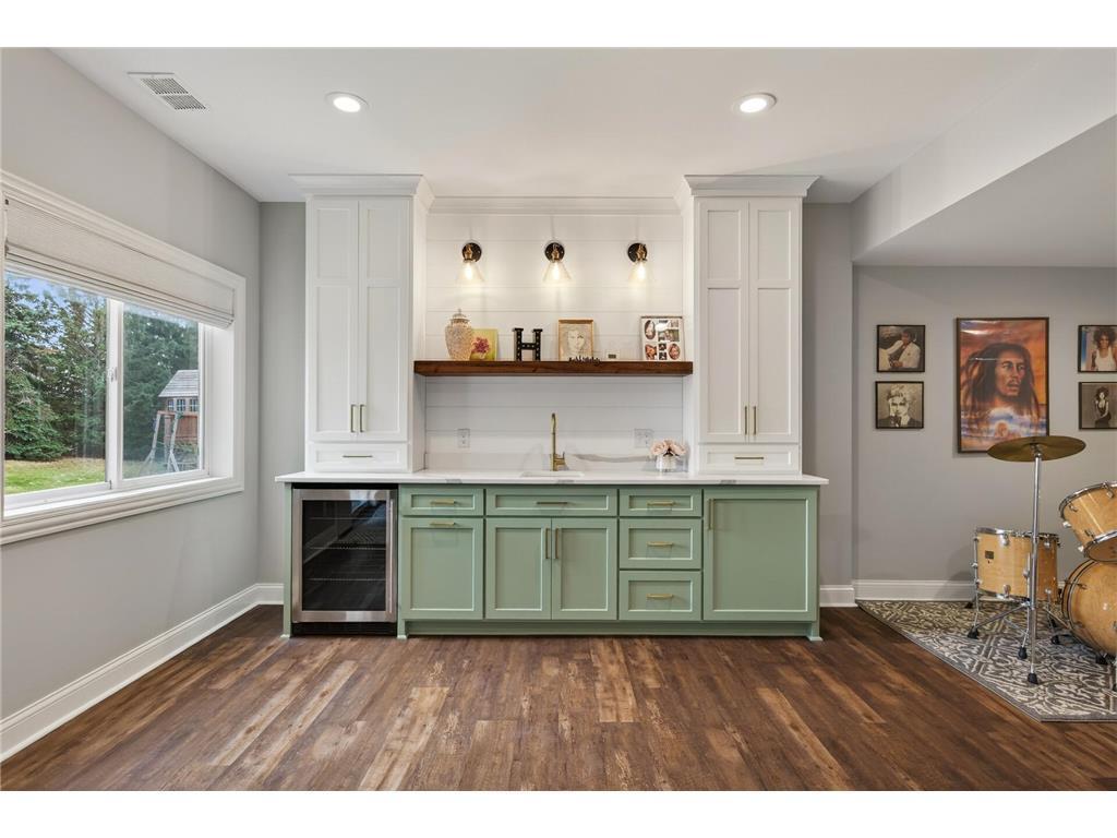 Custom bar w/quartz, mini fridge, cabinets, sink