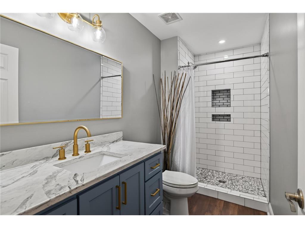 Custom cabinet, quartz, subway tile lower level 3/4 bath