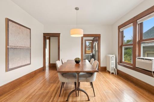 Nine-foot ceilings, original oak woodwork, hardwood floors, and a large dining room that flows straight from the living room.