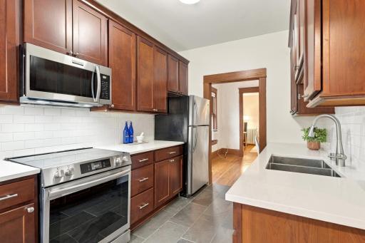 The 2020 kitchen remodel brought quartz counters, white subway tile, and slate floors.