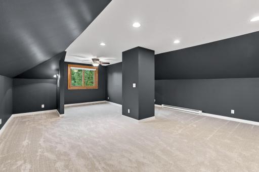 The finished upper level is wide open. New carpet, and fresh paint up here as well.