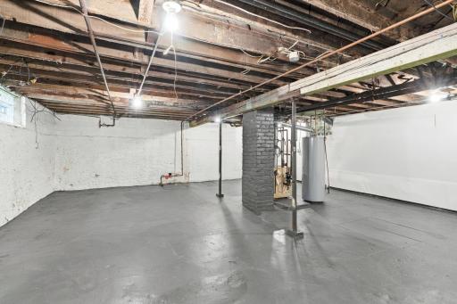 Drain tile, wall encapsulation, and a sump pump went in during 2024, all under transferable warranties. There's also a freshly painted floor, a tuned-up boiler, and a whole lot of square footage waiting on your plans.
