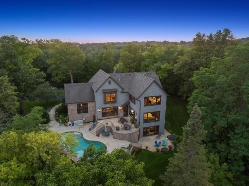 The yard is ideal for enjoying the outdoors, whether relaxing on the terraces, lounging by the pool, or gardening.