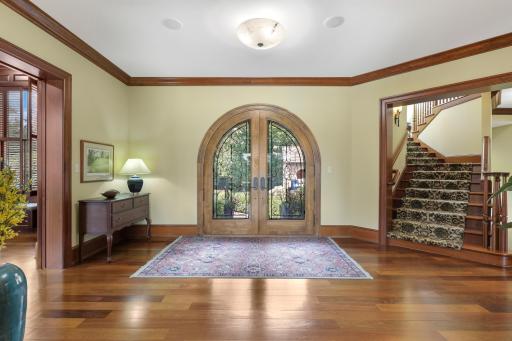 Welcoming open foyer with cherry accents.