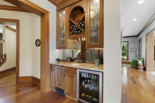 Thoughtfully positioned just off the dining room, the wet bar adds an elegant touch of convenience for hosting and entertaining.