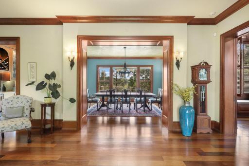 The expansive dining room offers a beautiful setting for entertaining, with picturesque views overlooking the terrace and pool.