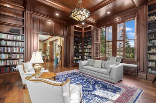Surrounded by books and bathed in natural light, this inviting library offers built-in window benches and floor-to-ceiling shelving - a quiet place to linger.