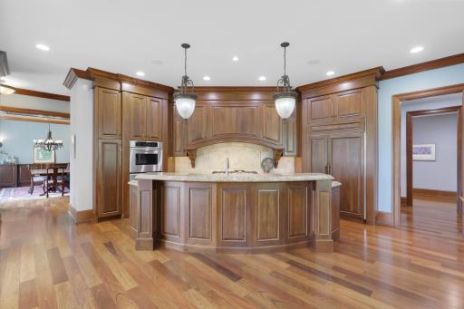 Exceptional function meets timeless design with Sub-Zero and Thermador appliances, a commanding range hood, and a butler’s pantry accented by elegant marble countertops.