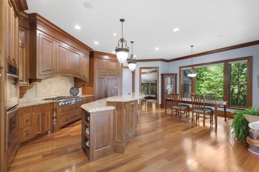 Designed for easy everyday living and entertaining, the kitchen opens to the informal dining room.