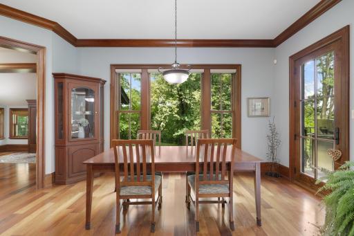 The kitchen opens naturally to the informal dining room and connects directly to a dedicated outdoor grilling area, complete with a Ventulux natural gas grill.