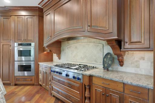 Exceptional function meets timeless design with Sub-Zero and Thermador appliances, a commanding range hood, and a butler’s pantry accented by elegant marble countertops.