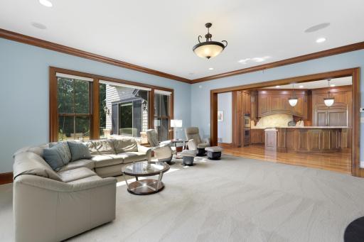 Large windows bring the tranquil beauty of Ferndale Marsh into the living room, while a welcoming fireplace, handsome built-in cabinetry, and thoughtful architectural details create a warm and inviting setting.