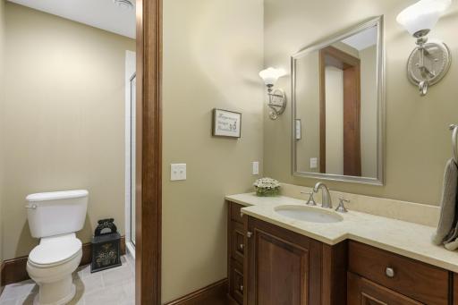 A convenient three-quarter bath complements the lower level’s recreation and living spaces.