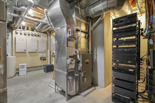 A well-organized utility room houses the home’s essential systems, including tankless water heaters, HVAC equipment, and supporting mechanicals.