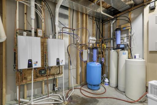 A well-organized utility room houses the home’s essential systems, including tankless water heaters, HVAC equipment, and supporting mechanicals.