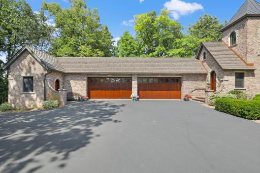 Exterior view of the home’s three-car garage, offering convenient access and ample parking.