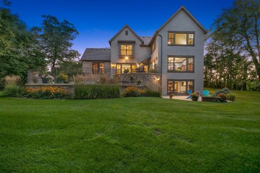 Surrounded by mature landscaping, the backyard provides exceptional privacy.