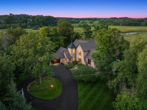 Located on one of Minnesota's most distinguished streets, this 2005 Jyland is tucked beautifully into its 3+ acre, resort-like setting, with 360 degrees of wooded privacy, expansive wetland views.