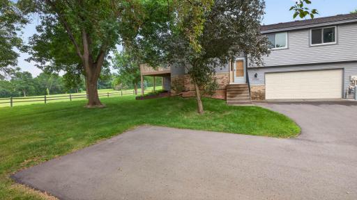 Newer Roof and siding! Large driveway for extra parking!