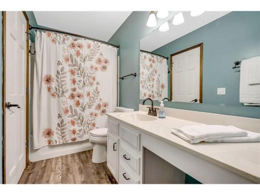 Great storage with cabinets, drawers, stool area, and linen closet.