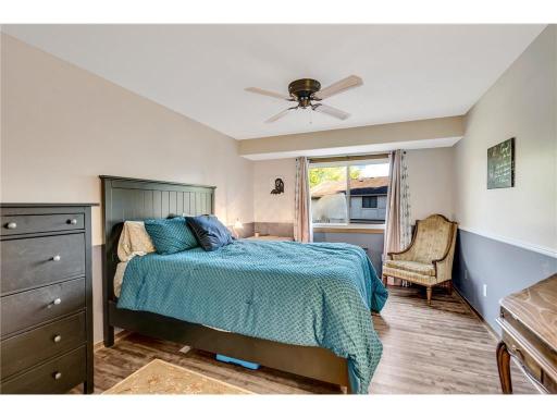 One of TWO bedrooms on the upper level. Updated flooring continues throughout the bedrooms...