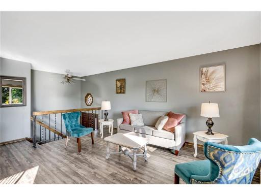 The upper-level Gathering Room is filled with natural light. Enjoy the newer floorings throughout this level.