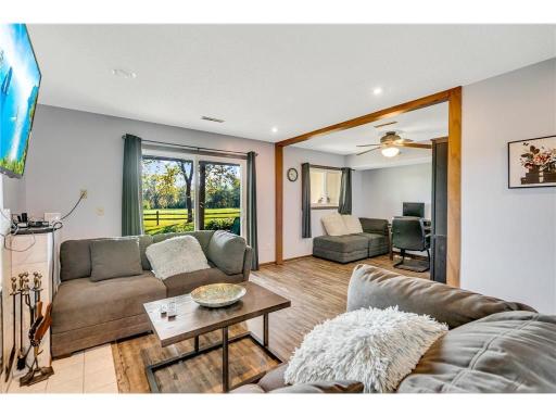 Awesome multi-use area and/or potential for another bedroom! Walk right out to the patio that leads to the extensive side yard and open space.