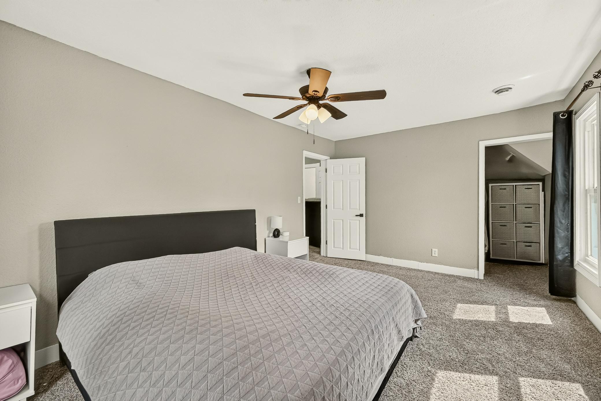 primary bedroom with walk-in closet