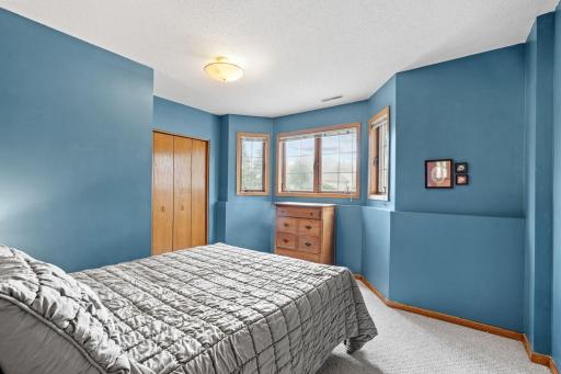 Lower level bedroom with a bay window and double closet.