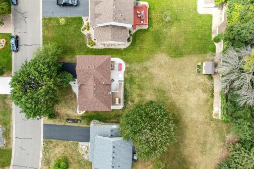 Overhead aerial view of the home, driveway, and rear yard.