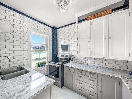 Updated kitchen with bright light pouring in a large window!