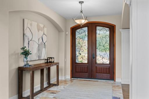 Stunning front foyer with tile floors.