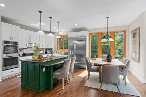 Stunning kitchen with double wall ovens, and a semaledd flow into the informal dining space.