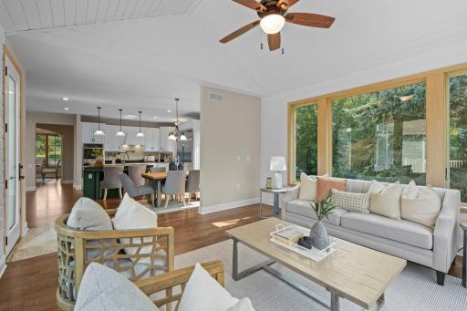 Sunroom with wood accents accentuate the vaulted ceilings with deck access.