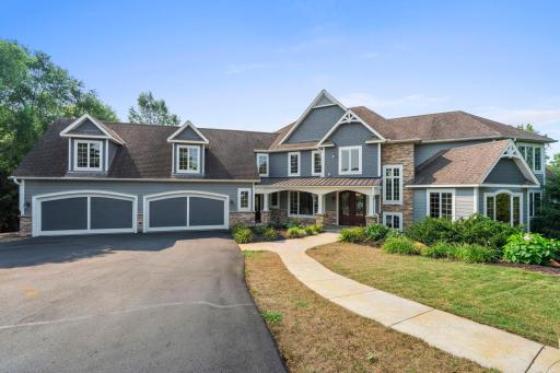 This seven bedroom, six bathroom residence spans three finished levels connected by a private elevator, offering flexibility and ease of movement throughout the home.